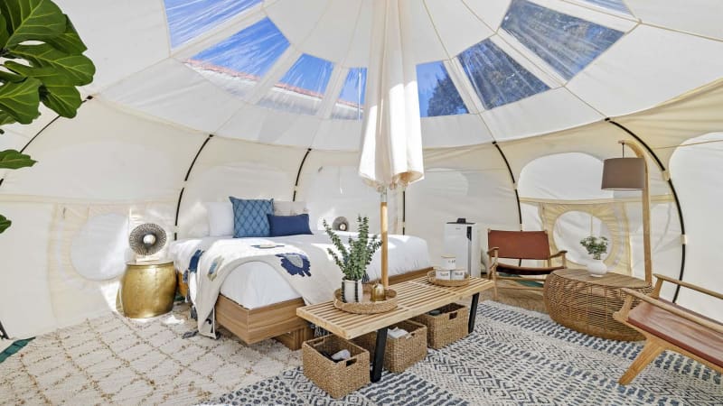 The inside of a glamping one mile beach tent